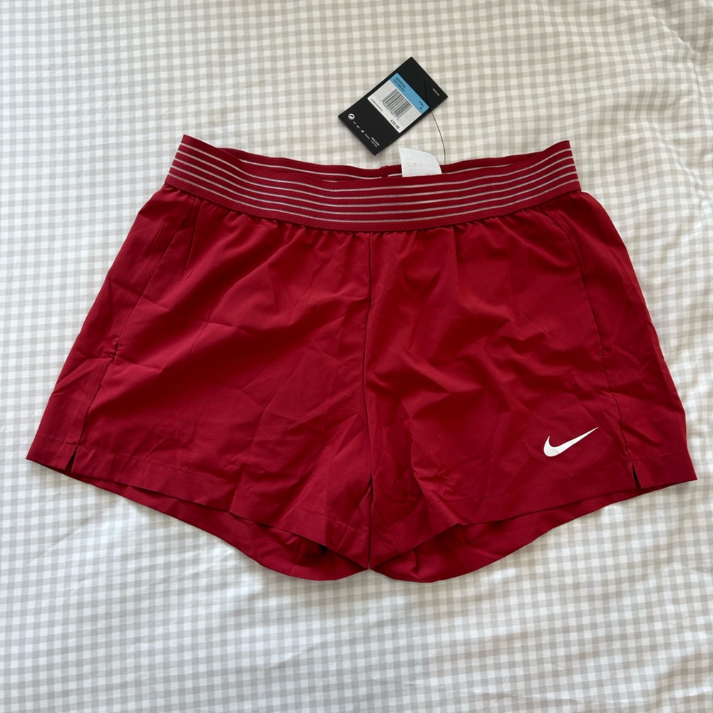 Women’s crimson (red) NIKE shorts size medium. NEW with tags.